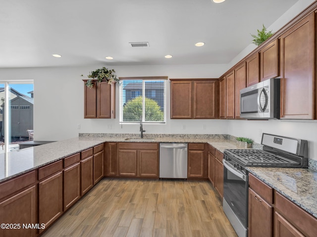4580 Centaurus Rd, Bellemont, AZ 86015 - kitchen featuring plenty of natural light, stainless steel appliances, visible vents, and a sink
