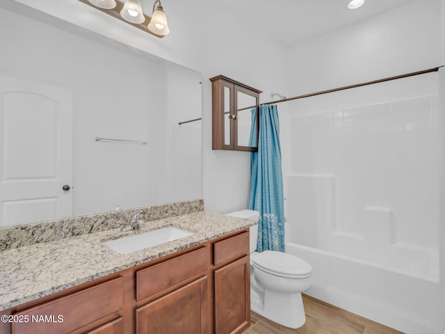 4580 Centaurus Rd, Bellemont, AZ 86015 - full bathroom featuring shower / bath combination with curtain, toilet, vanity, and wood finished floors