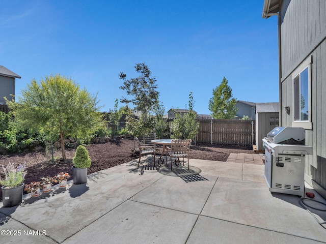 4580 Centaurus Rd, Bellemont, AZ 86015 - view of patio featuring a fenced backyard, a grill, and outdoor dining space