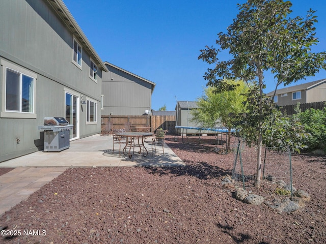 4580 Centaurus Rd, Bellemont, AZ 86015 - view of yard with a fenced backyard, a patio area, and a trampoline
