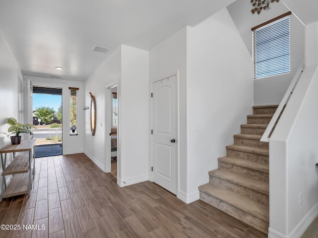 4580 Centaurus Rd, Bellemont, AZ 86015 - foyer entrance featuring stairway, baseboards, wood finished floors, and visible vents