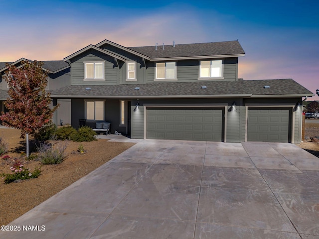4580 Centaurus Rd, Bellemont, AZ 86015 - traditional home featuring concrete driveway, an attached garage, and a shingled roof