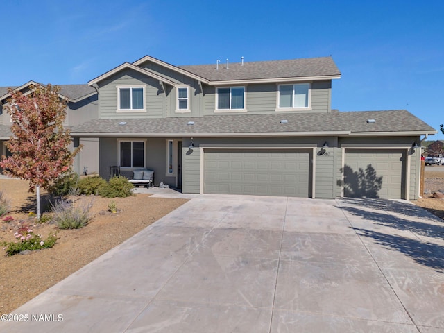 4580 Centaurus Rd, Bellemont, AZ 86015 - traditional-style house with driveway, a shingled roof, and a garage