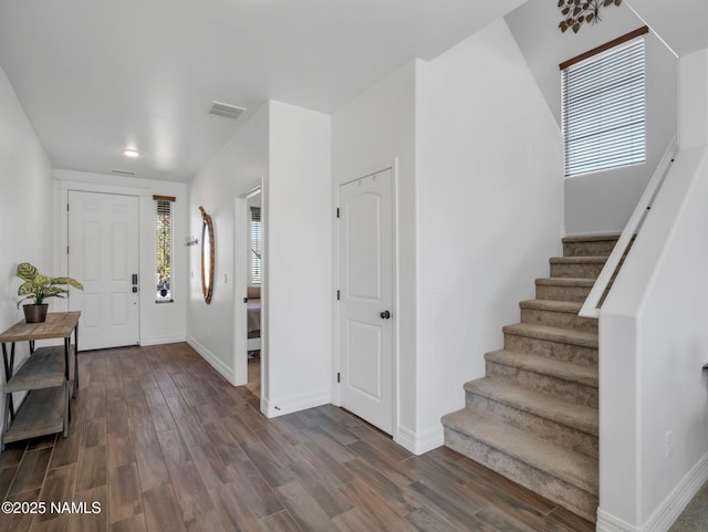 4580 Centaurus Rd, Bellemont, AZ 86015 - entrance foyer with dark wood finished floors, baseboards, stairs, and visible vents