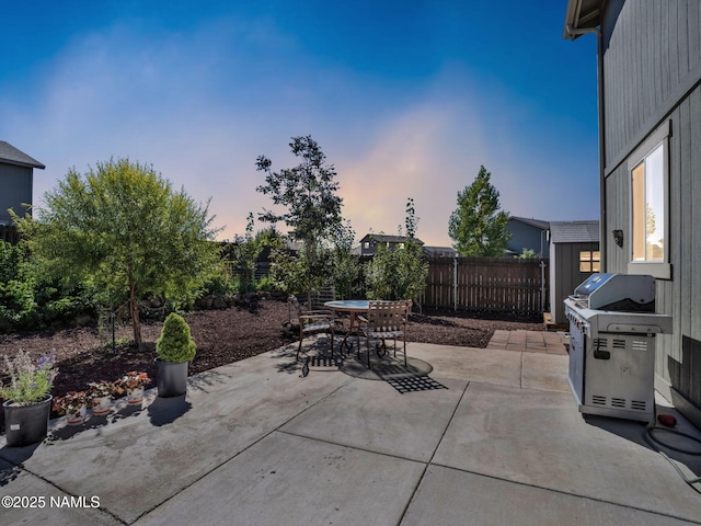 4580 Centaurus Rd, Bellemont, AZ 86015 - view of patio with grilling area, outdoor dining space, and a fenced backyard