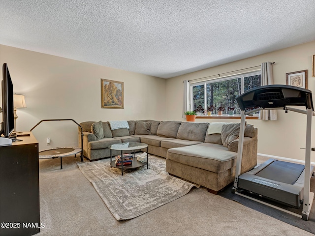 carpeted living room featuring a textured ceiling