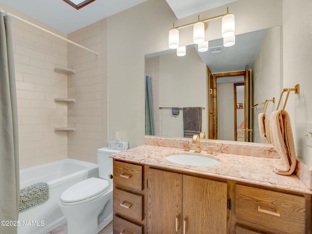 bathroom with toilet, shower / tub combo, visible vents, and vanity