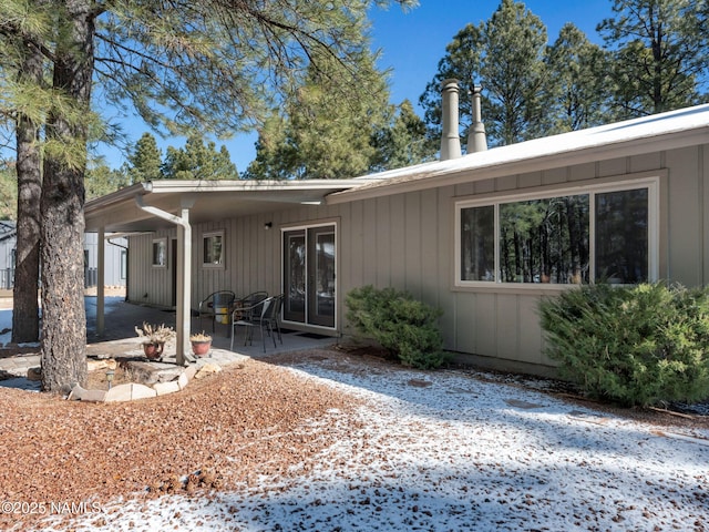 rear view of property with french doors and a patio