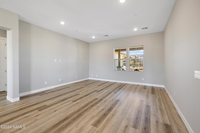 unfurnished room featuring light wood-type flooring