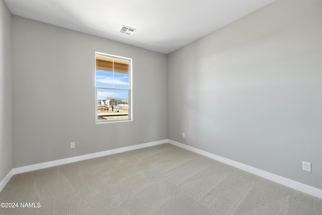 unfurnished room with carpet floors