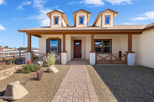 view of front of home featuring covered porch