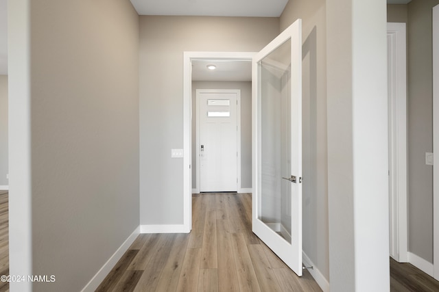 hall with light wood-type flooring