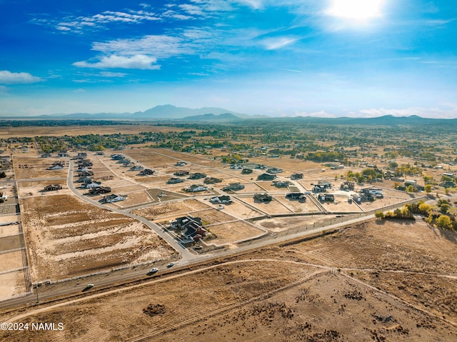 birds eye view of property with a mountain view