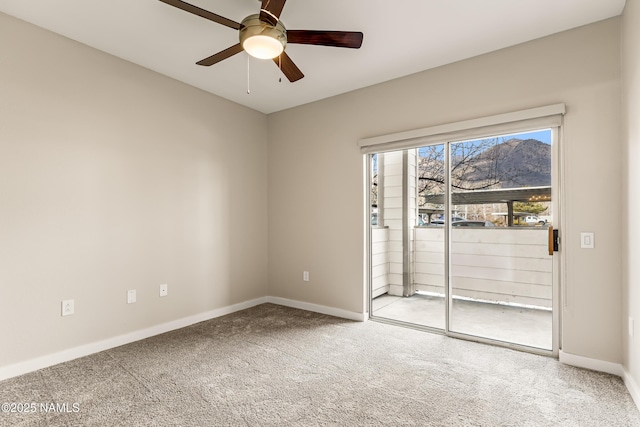 unfurnished room with carpet flooring and ceiling fan