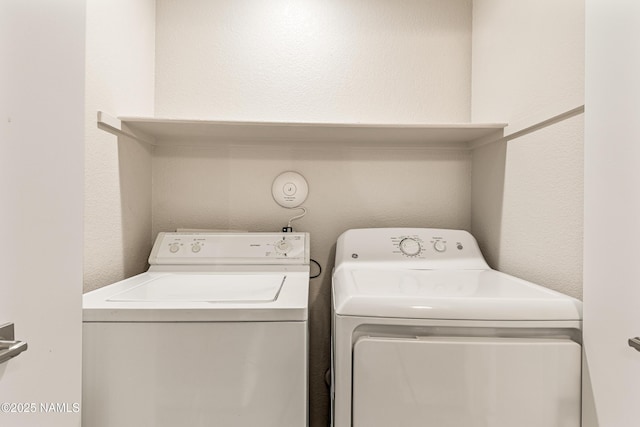 laundry room with washing machine and dryer