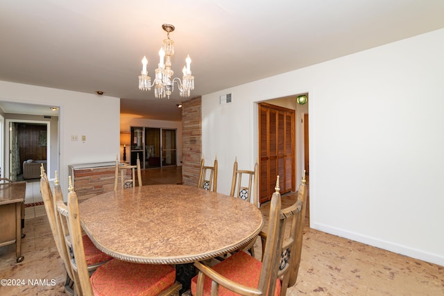 dining area featuring a chandelier