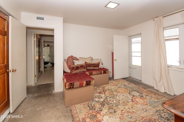 living area with concrete floors