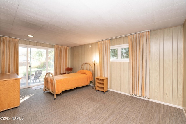 carpeted bedroom with access to exterior