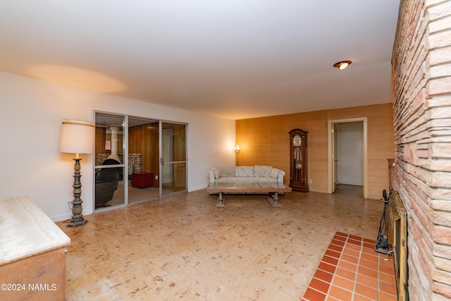 interior space featuring a fireplace, a closet, and a wood stove