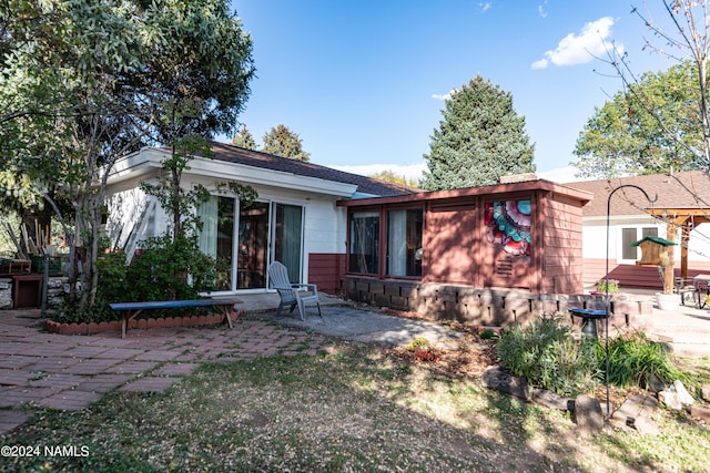 ranch-style house with a patio