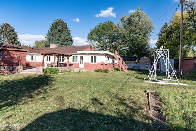 view of yard with a patio and a shed