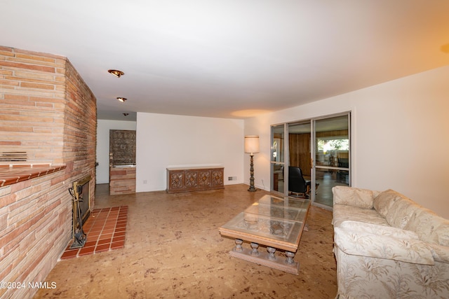 living room with a tiled fireplace