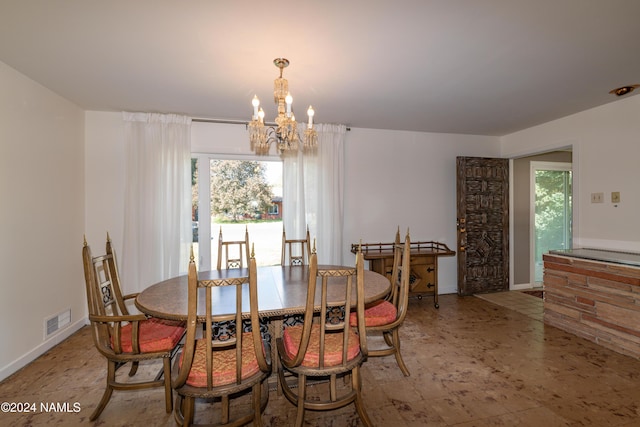 dining room featuring a chandelier