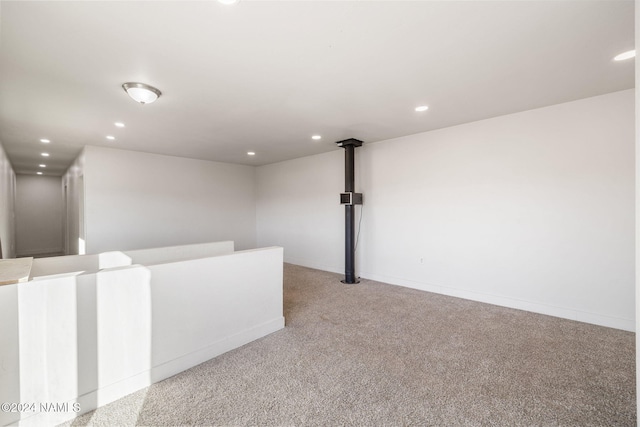 spare room featuring light colored carpet