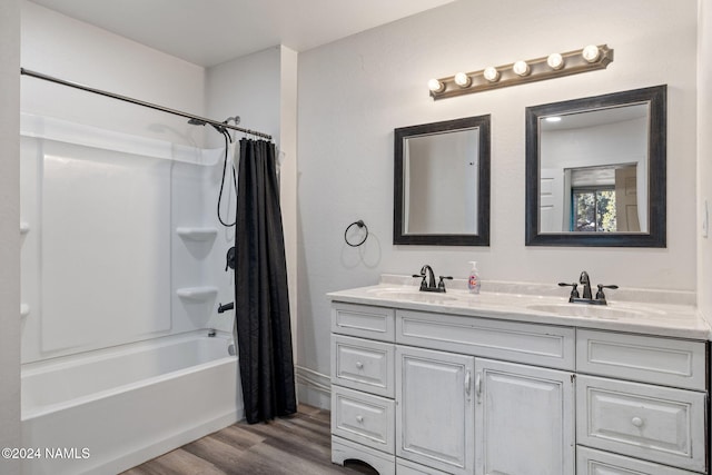 bathroom featuring hardwood / wood-style flooring, vanity, and shower / bath combination with curtain