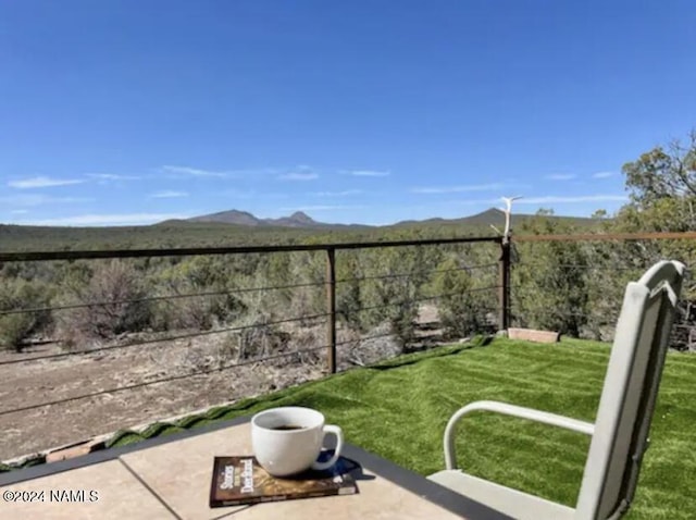 exterior space with a mountain view and a patio