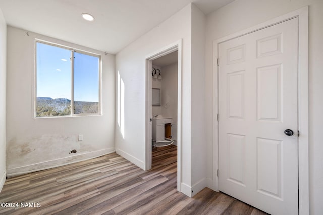 interior space with a mountain view and hardwood / wood-style floors