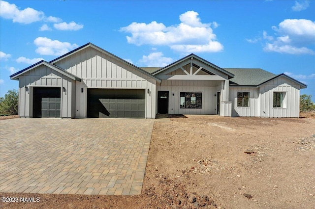 modern farmhouse featuring a garage