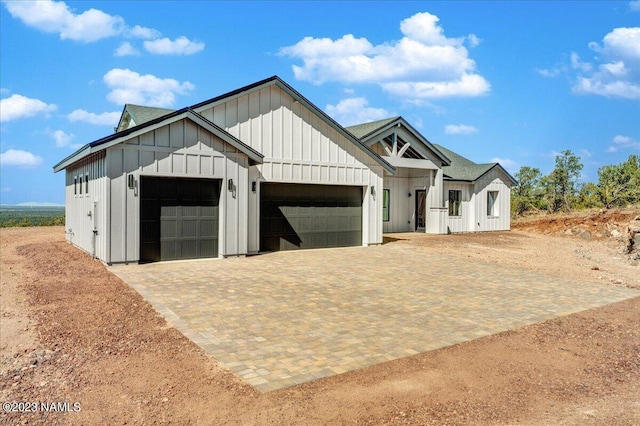 modern farmhouse style home with a garage