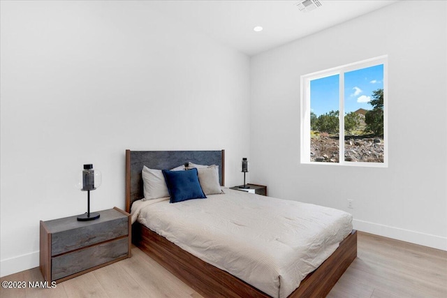 bedroom featuring light hardwood / wood-style floors