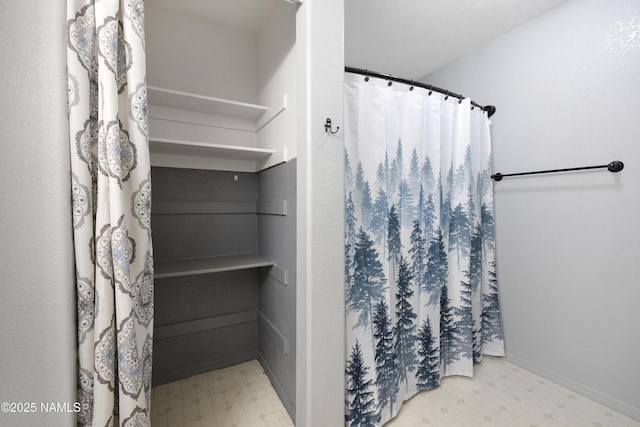 6437 N Conrad Ln, Flagstaff, AZ 86004 - bathroom featuring tile patterned floors and a shower with curtain
