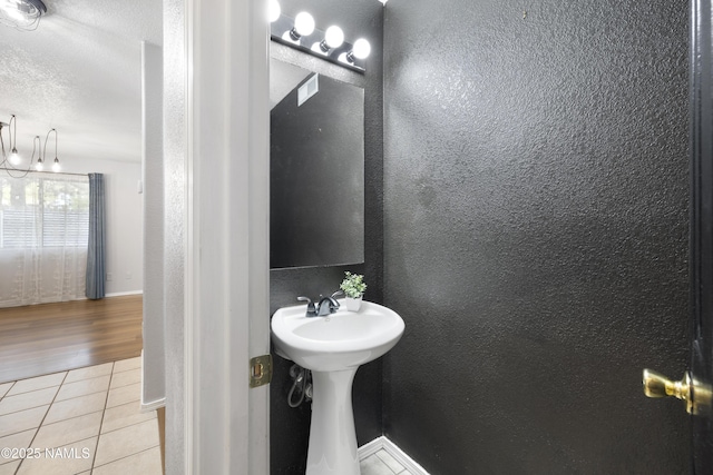 6437 N Conrad Ln, Flagstaff, AZ 86004 - bathroom with tile patterned flooring and a textured wall