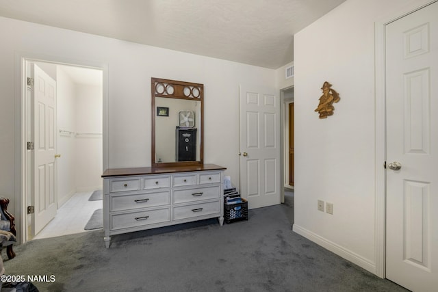 bedroom with carpet, visible vents, and baseboards