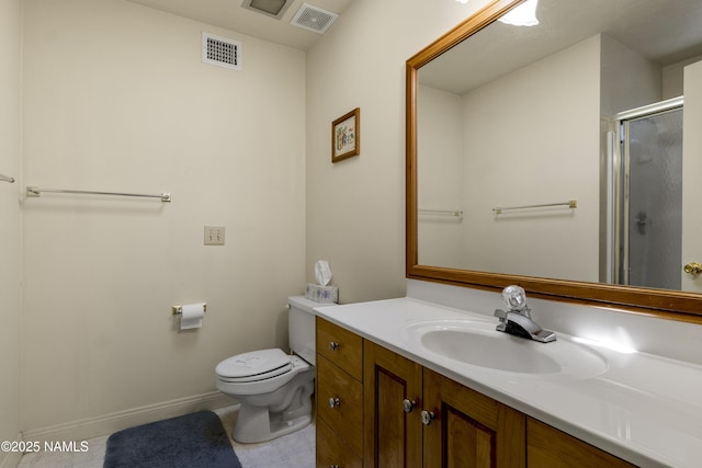 bathroom featuring toilet, a stall shower, visible vents, and vanity