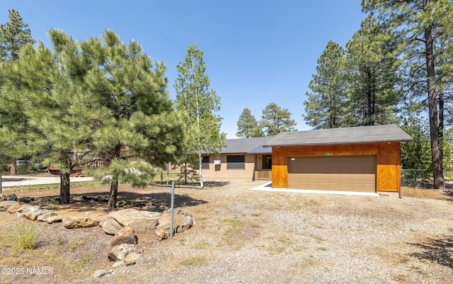 view of front of home with driveway and an attached garage