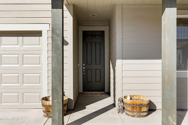 entrance to property featuring a garage