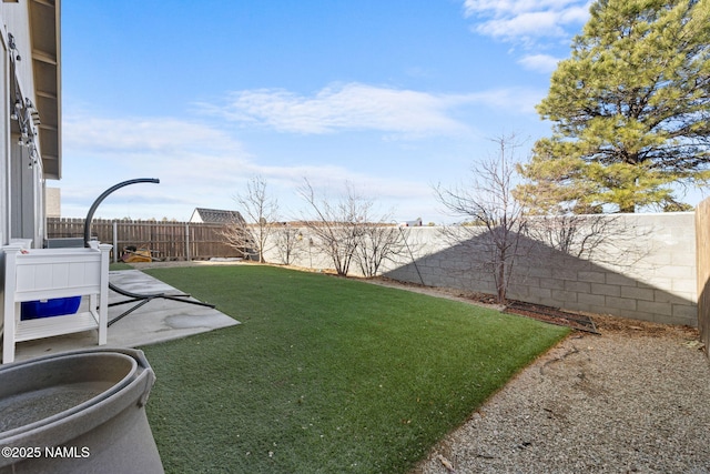 view of yard with a fenced backyard