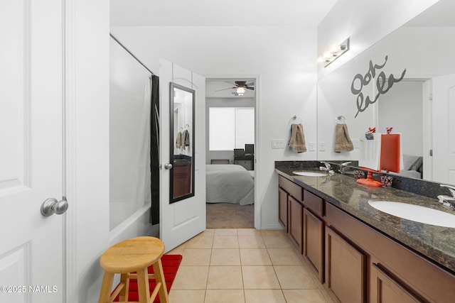 full bath featuring a ceiling fan, connected bathroom, a sink, and tile patterned floors