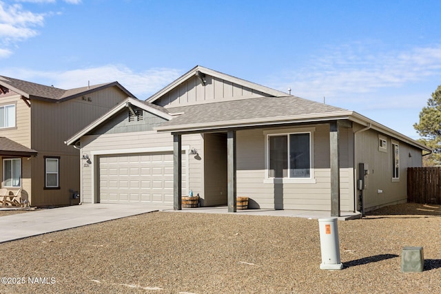 ranch-style home with a garage, board and batten siding, a shingled roof, and concrete driveway