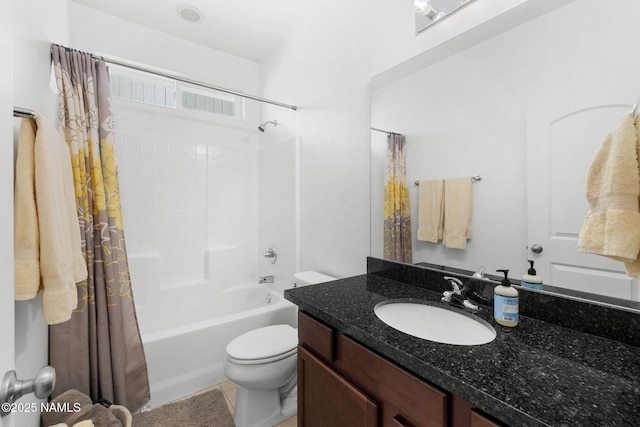 bathroom featuring shower / bath combination with curtain, vanity, and toilet