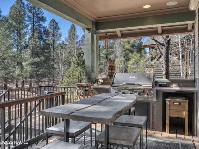 view of patio with a deck and grilling area