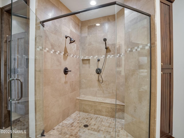 bathroom featuring an enclosed shower