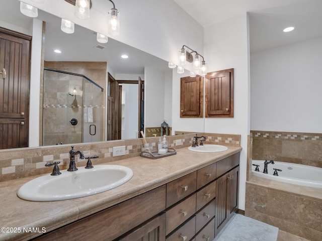 bathroom featuring vanity and plus walk in shower