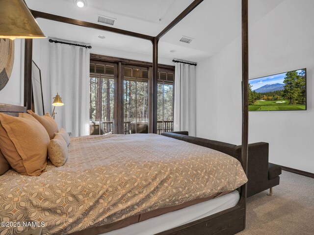 carpeted bedroom with access to exterior