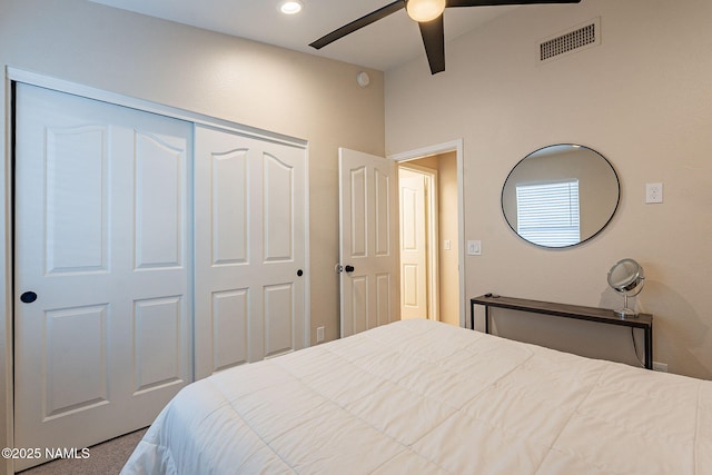 carpeted bedroom featuring ceiling fan and a closet