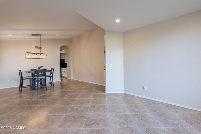 unfurnished dining area featuring vaulted ceiling